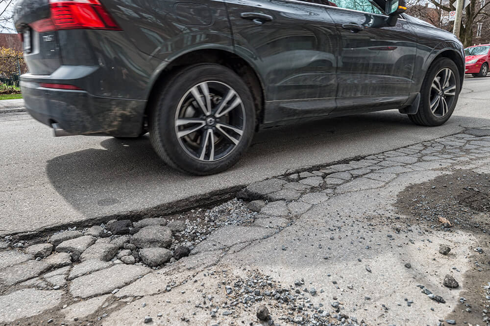 how potholes can wreak havoc on your vehicle